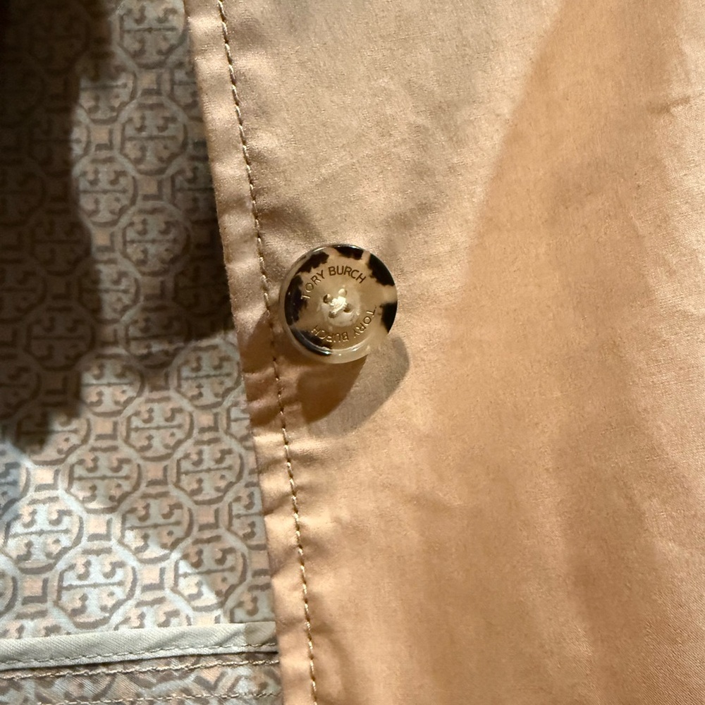 Tory Burch trench coat with ruffle detail. Great closet staple